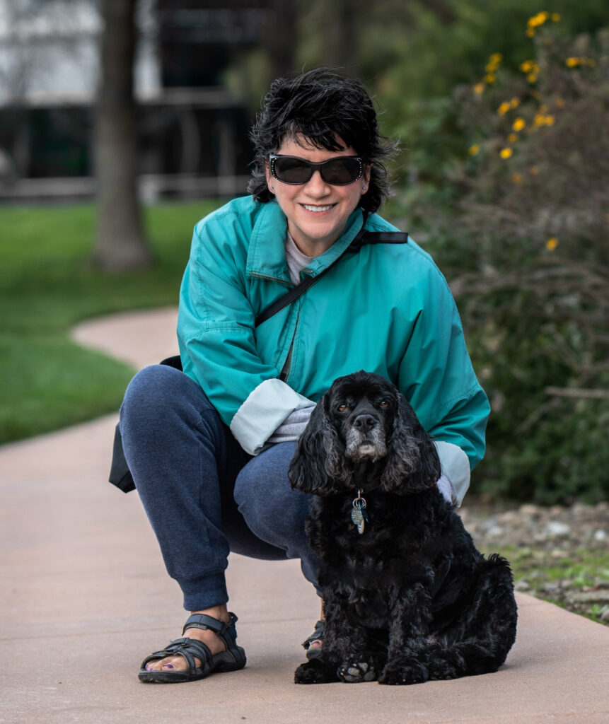 Woman with cocker spaniel at a local park