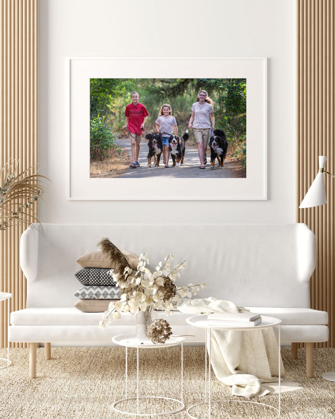 Living room with family picture of children and three dogs